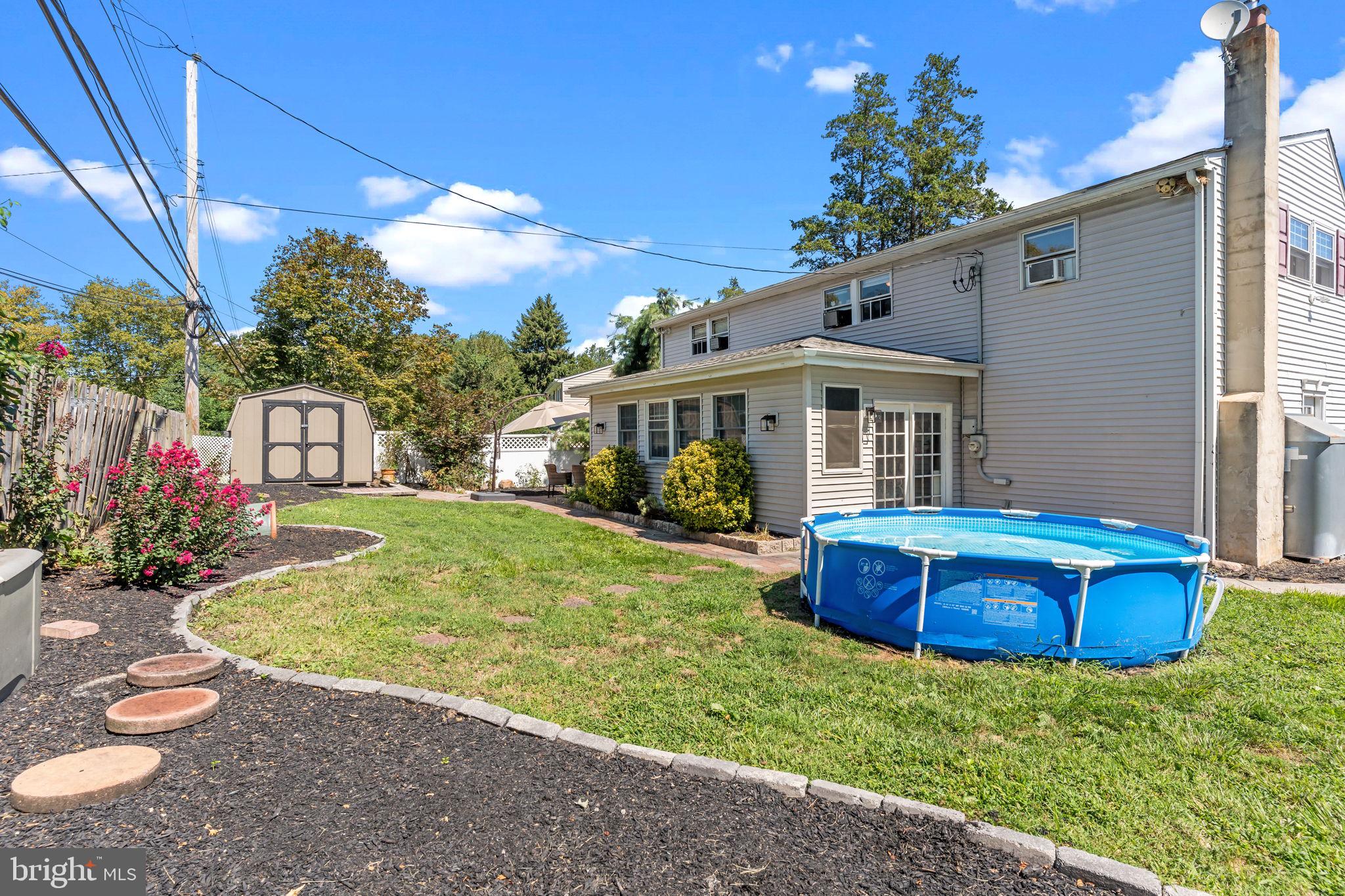 21 Downhill Road Levittown, PA 19056 - Photo 27 of 28 a front view of a house with garden