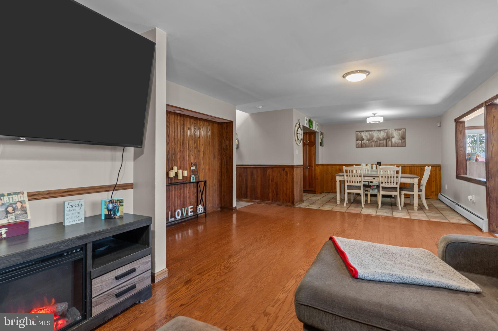 21 Downhill Road Levittown, PA 19056 - Photo 6 of 28 a living room with furniture and wooden floor