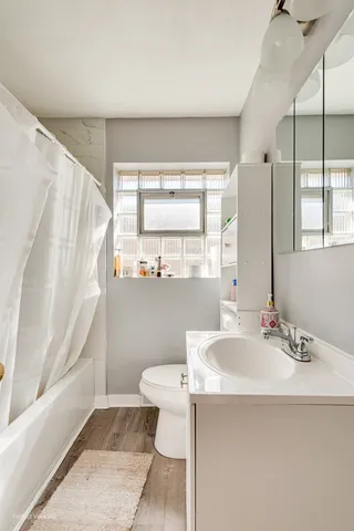 a bathroom with a sink a toilet and a bathtub
