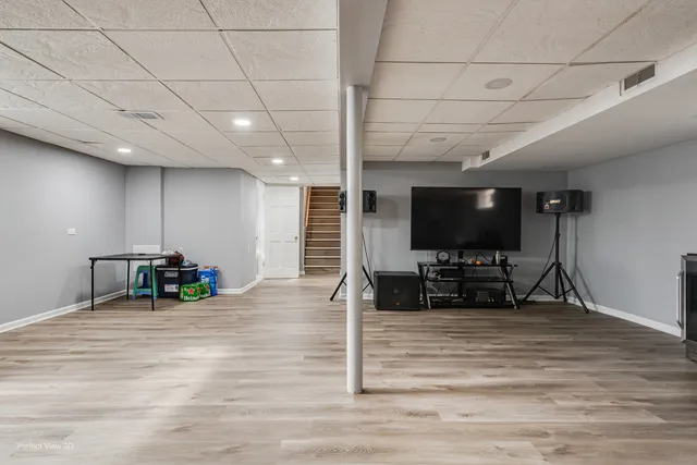 a view of a living room a couch and a flat screen tv