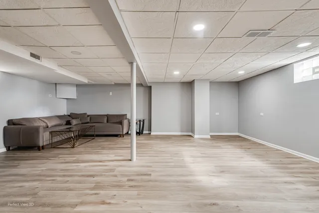 a view of kitchen with stainless steel appliances cabinets