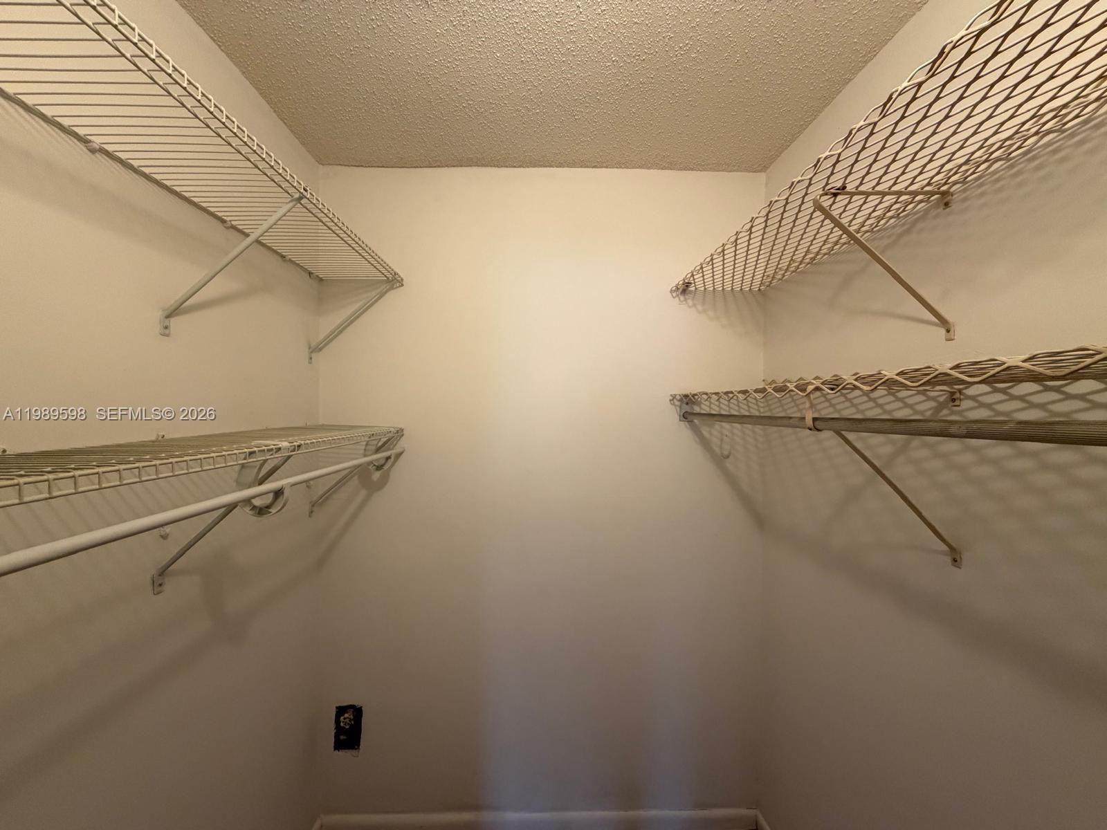 253 South Cypress Road, Unit 214 Pompano Beach, FL 33060 - Photo 11 of 25 a view of a room with racks on the wall