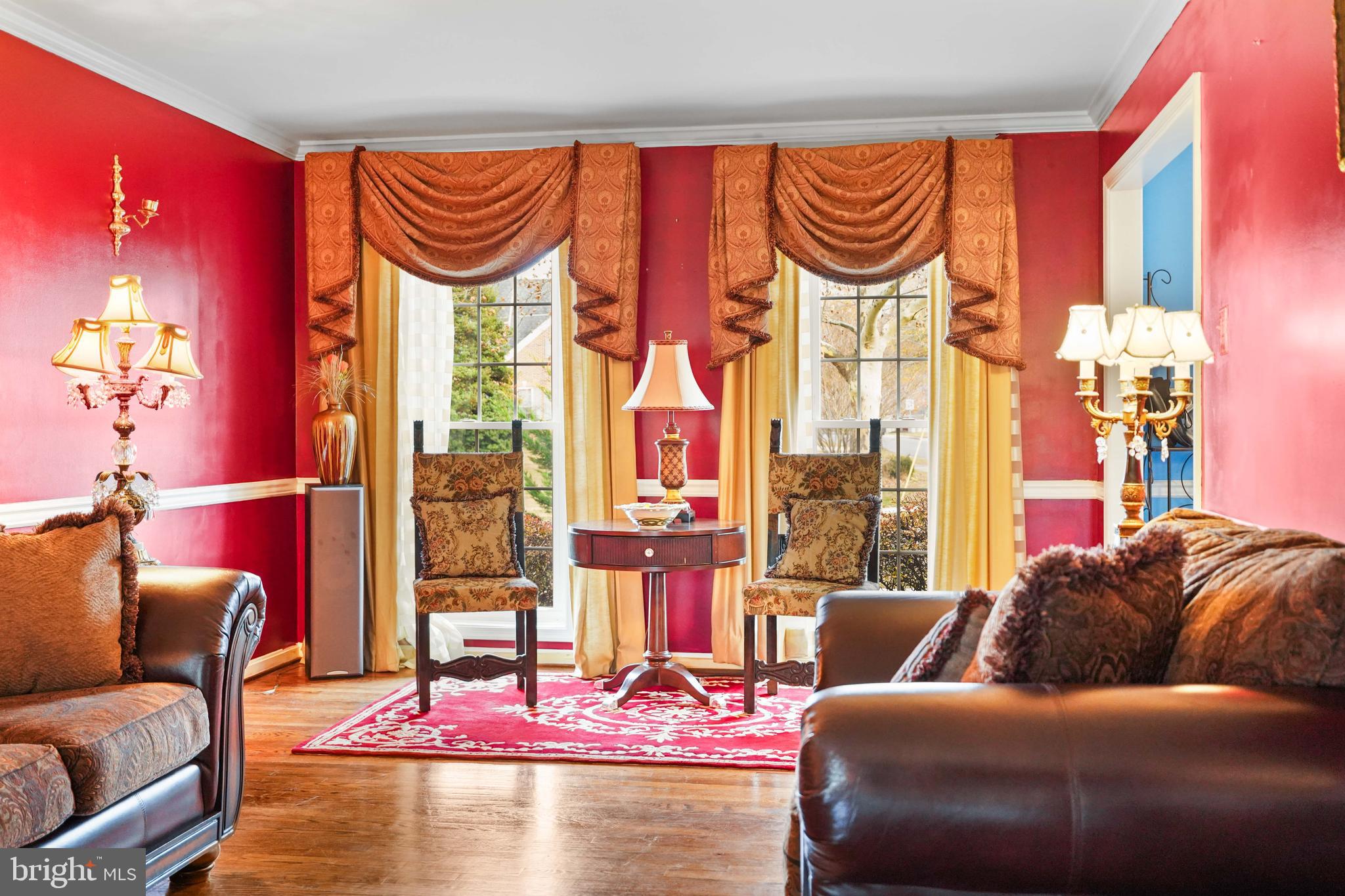 13940 Alderton Road Silver Spring, MD 20906 - Photo 11 of 41 a living room with furniture and a floor to ceiling window
