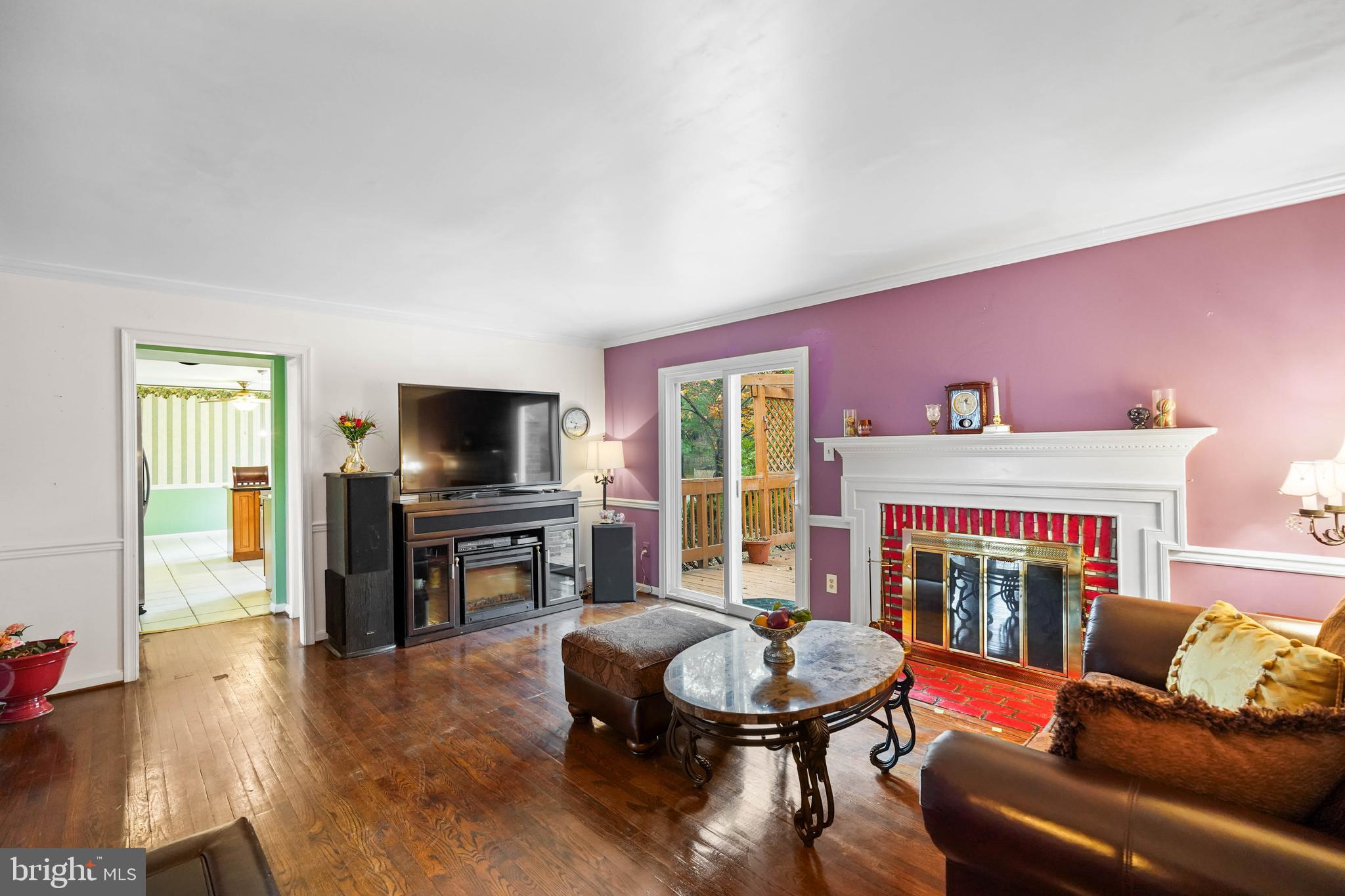 13940 Alderton Road Silver Spring, MD 20906 - Photo 12 of 41 a living room with furniture and a flat screen tv