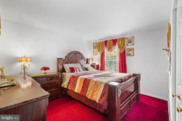 a bed room with a bed and a window