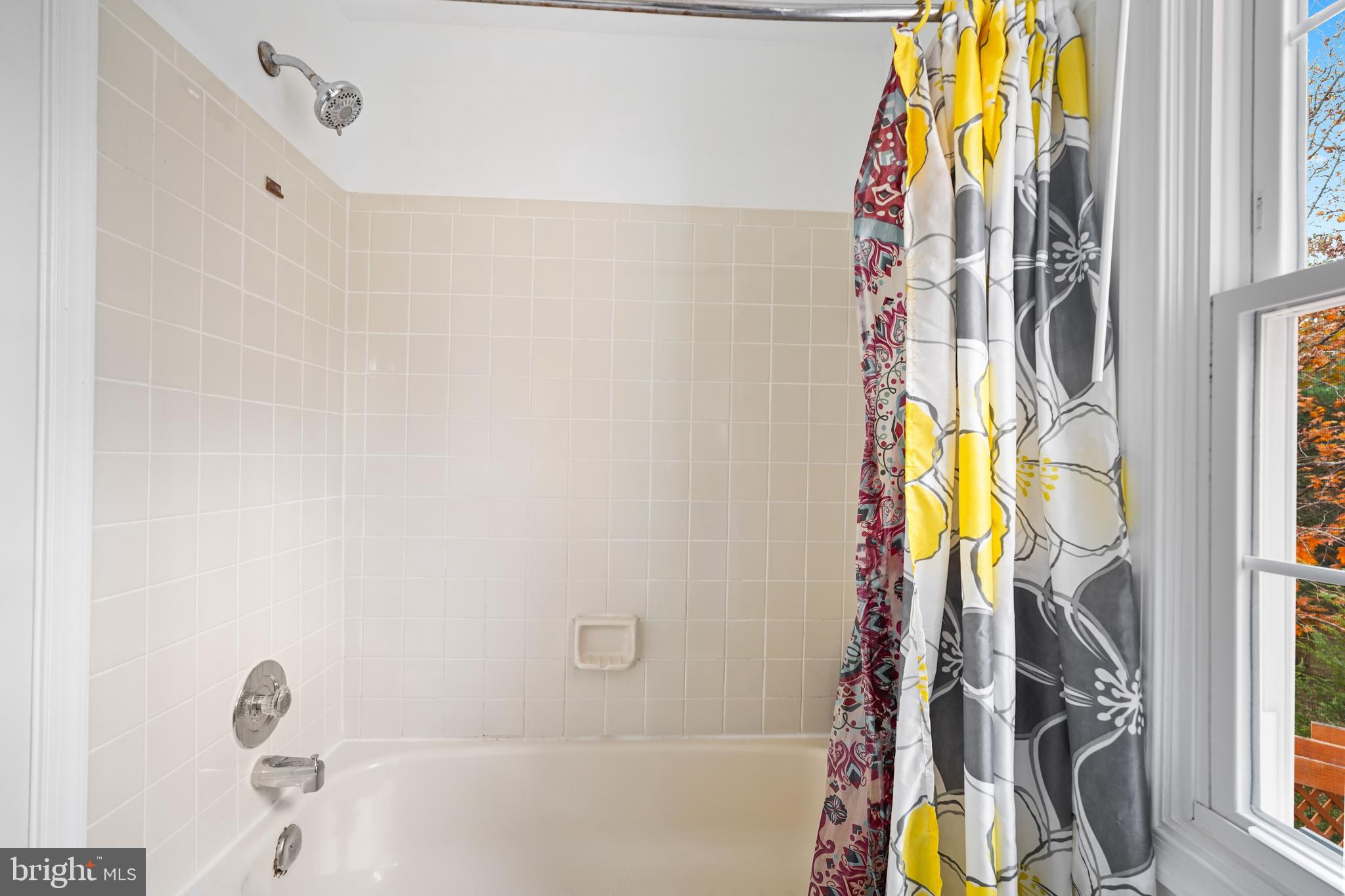 13940 Alderton Road Silver Spring, MD 20906 - Photo 19 of 41 a view of a bathtub & door