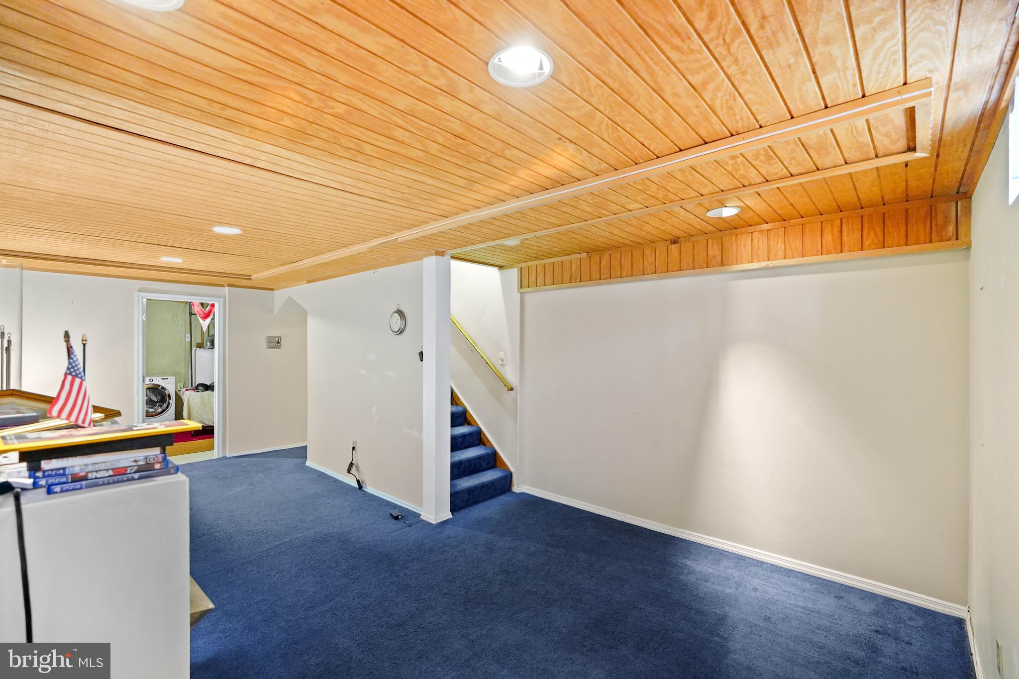 13940 Alderton Road Silver Spring, MD 20906 - Photo 25 of 41 an empty room with wooden floor and white walls