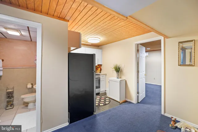 a bathroom with a shower a sink and a mirror