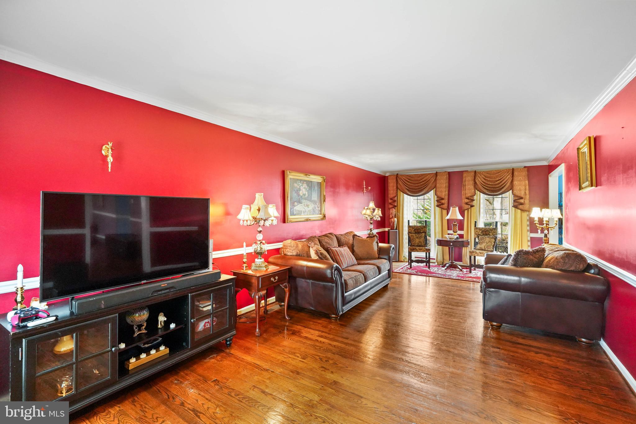 13940 Alderton Road Silver Spring, MD 20906 - Photo 5 of 41 a living room with furniture and a flat screen tv