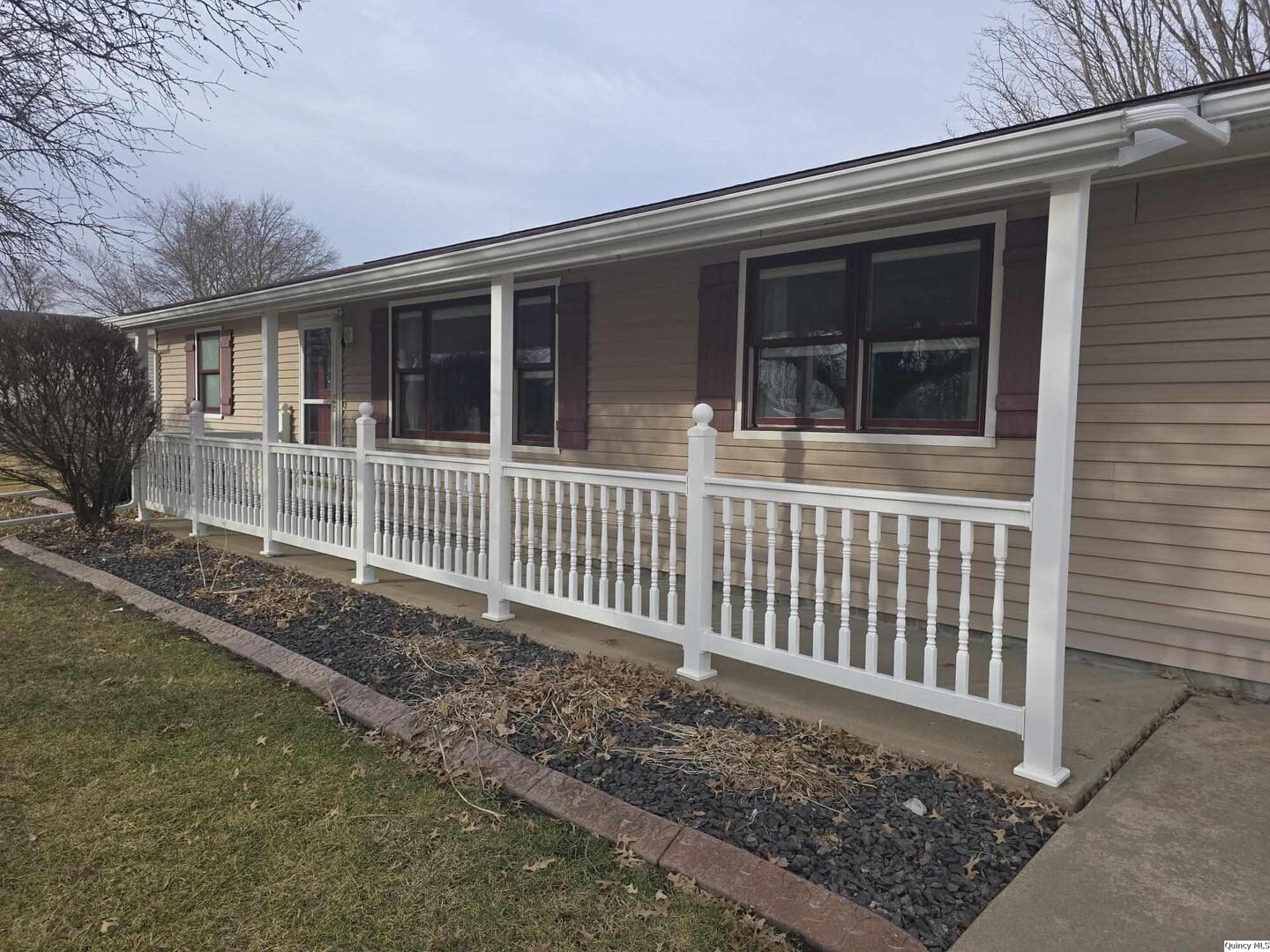 239 Rogers Road Carthage, IL 62321 - Photo 17 of 23 a front view of a house with a yard