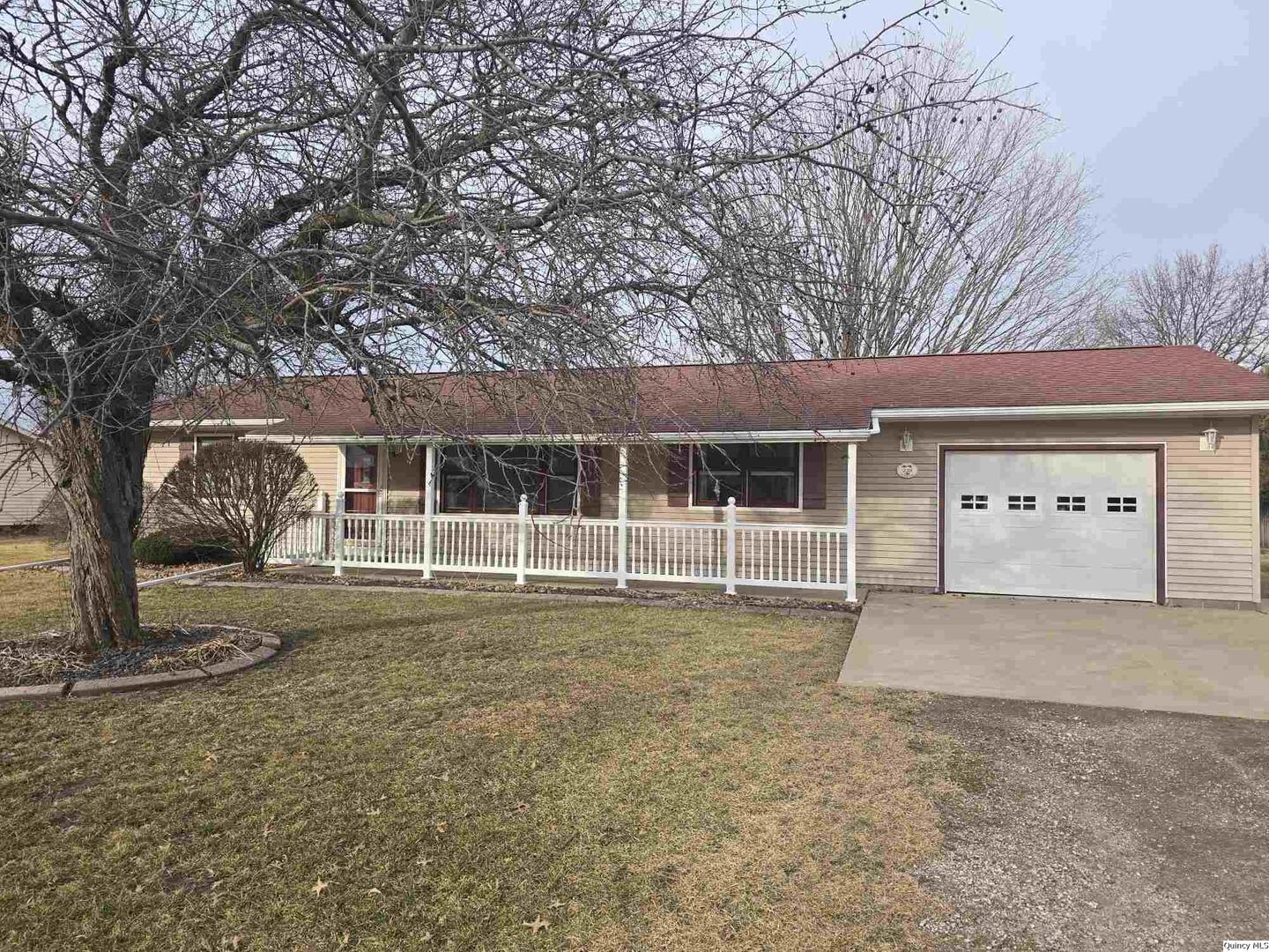 239 Rogers Road Carthage, IL 62321 - Photo 18 of 23 a front view of a house with a yard