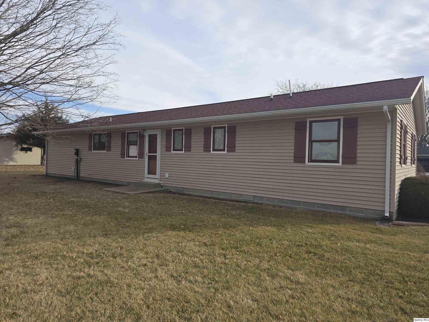 239 Rogers Road Carthage, IL 62321 - Photo 20 of 23 a view of a house with a backyard