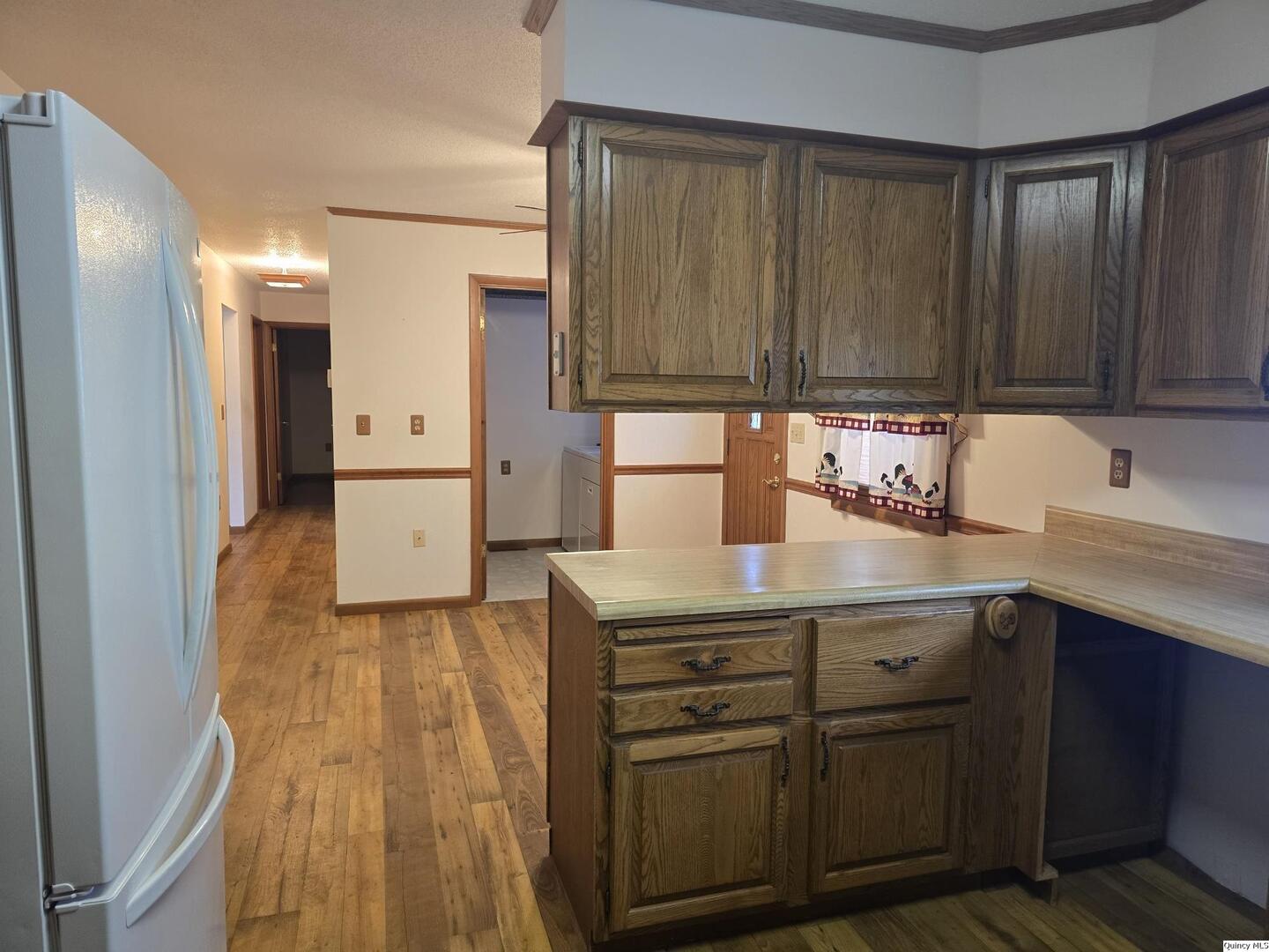 239 Rogers Road Carthage, IL 62321 - Photo 4 of 23 a kitchen with a sink and cabinets