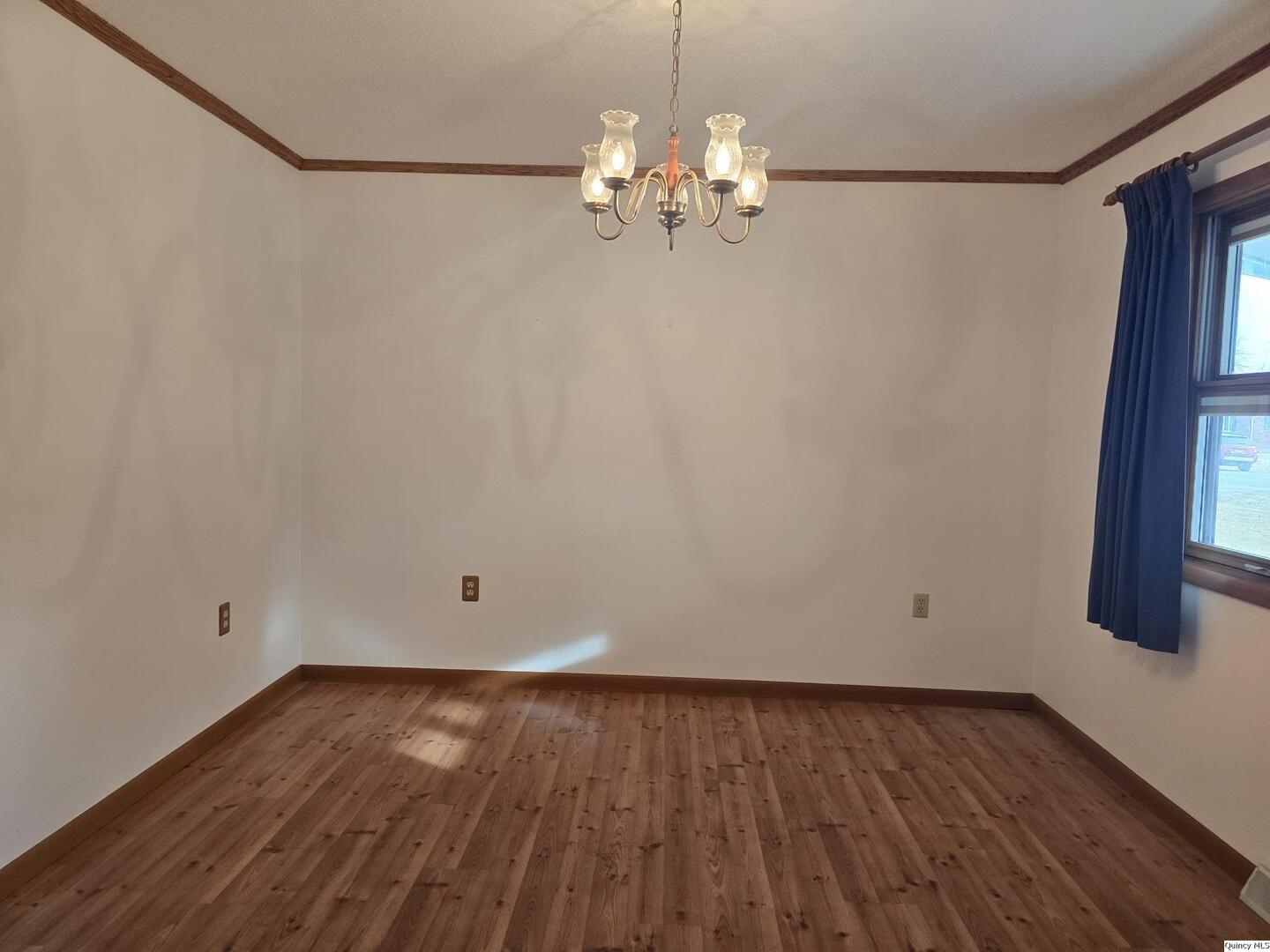 239 Rogers Road Carthage, IL 62321 - Photo 8 of 23 wooden floor in an empty room with a window