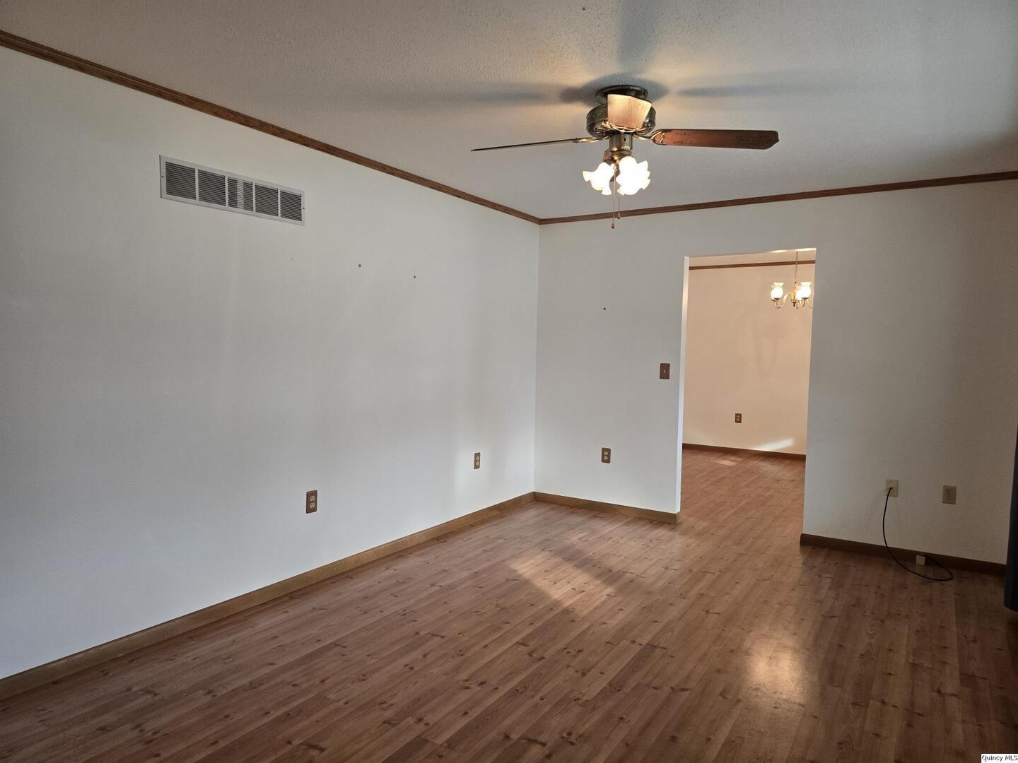 239 Rogers Road Carthage, IL 62321 - Photo 10 of 23 wooden floor in an empty room