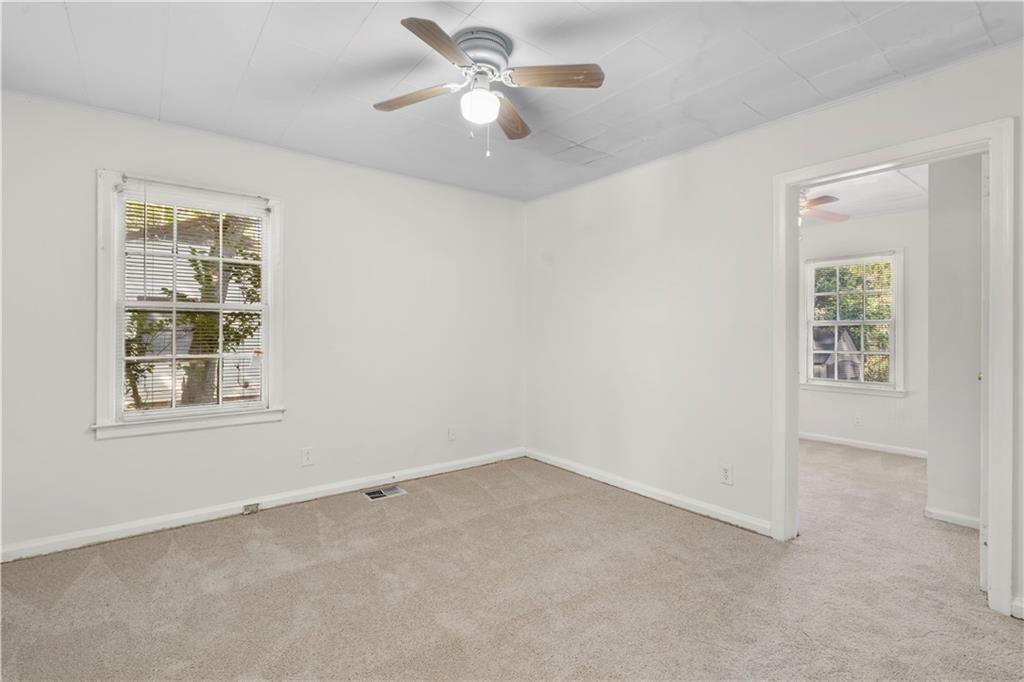 3589 Orchard Circle Decatur, GA 30032 - Photo 13 of 27 an empty room with windows and fan