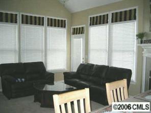 416 Third Baxter Street Fort Mill, SC 29708 - Photo 4 of 8 a living room with furniture and large windows