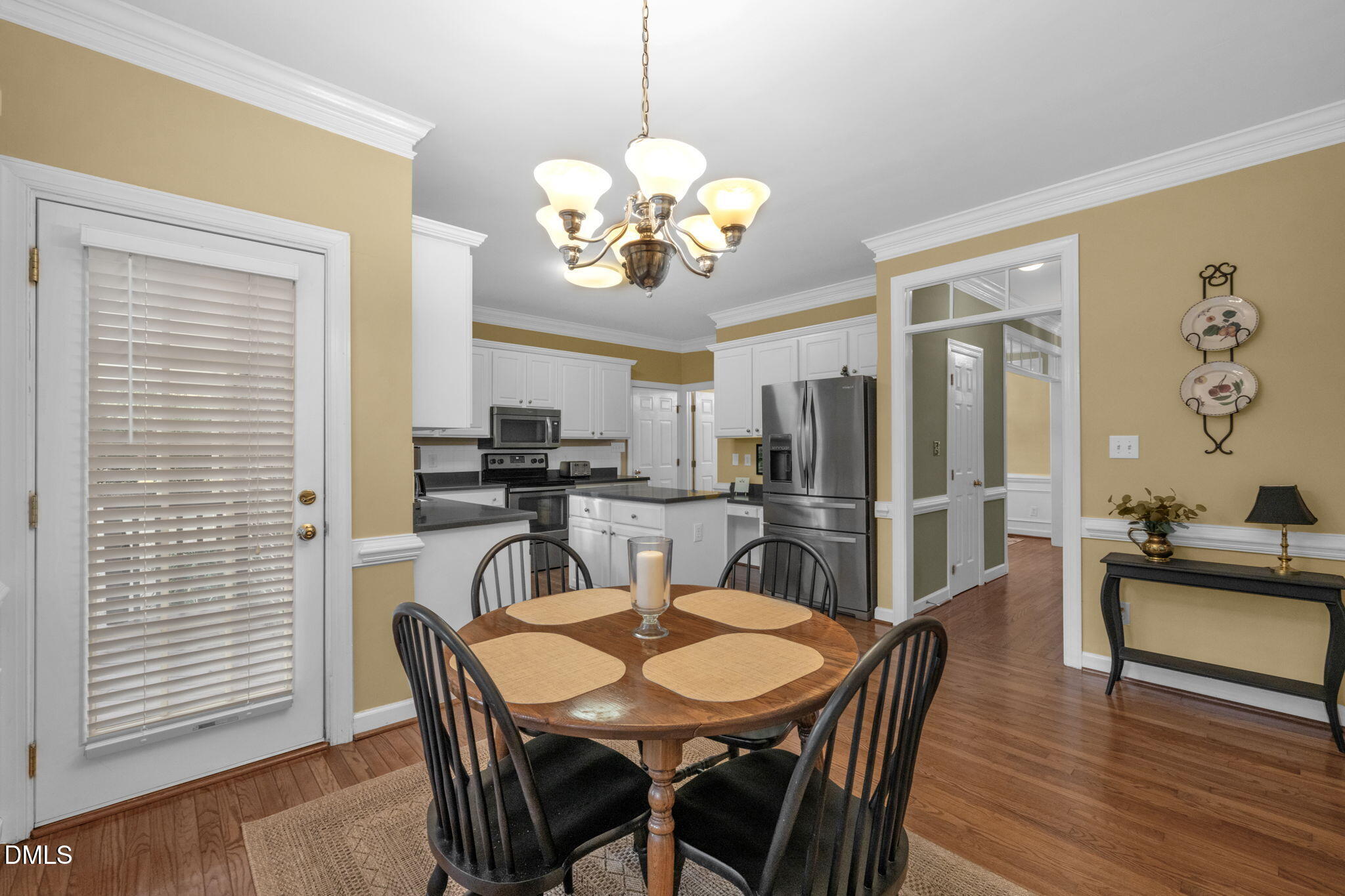 2605 Lizei Street Raleigh, NC 27616 - Photo 16 of 46 a view of a dining room with furniture and wooden floor