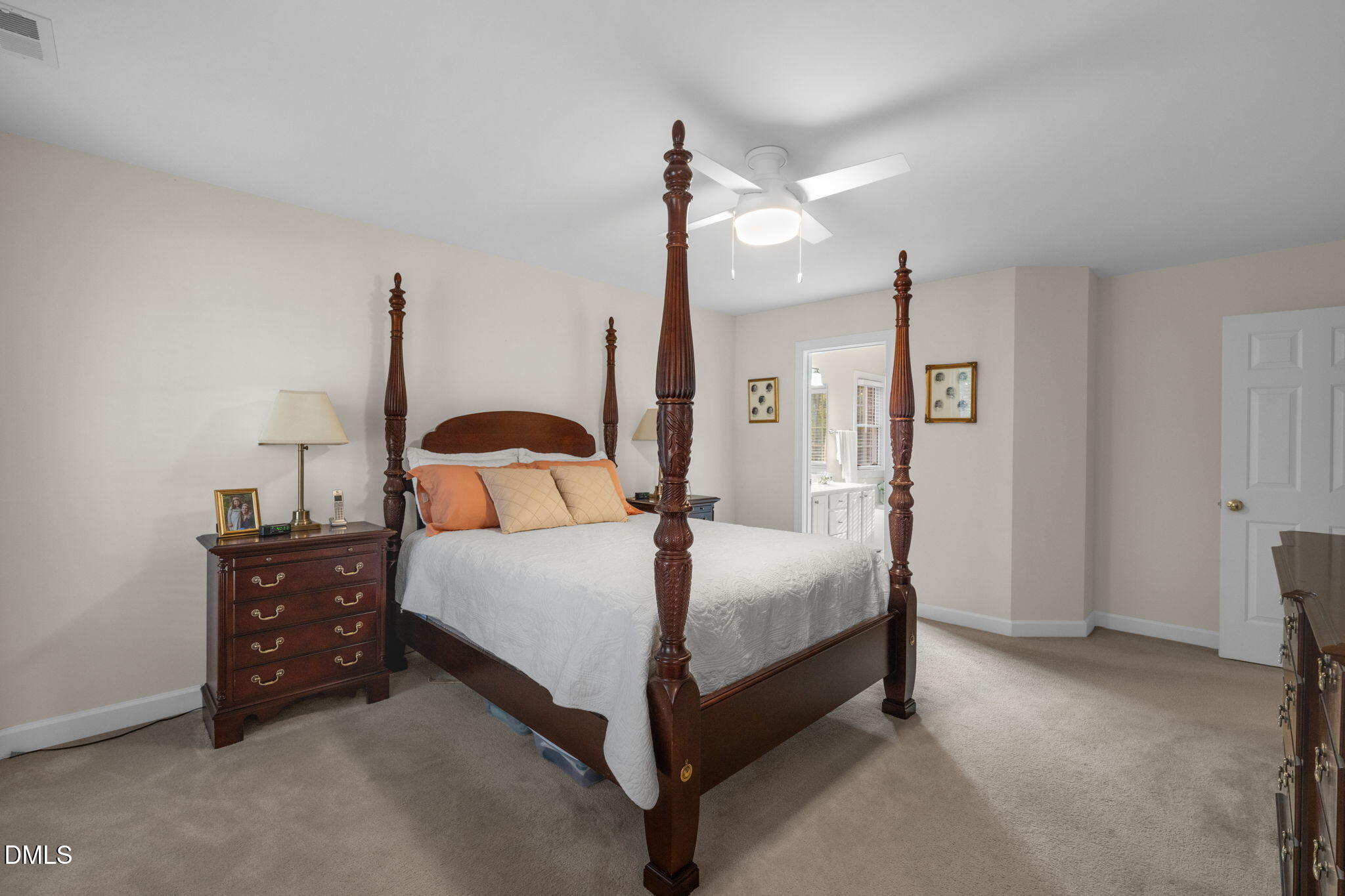 2605 Lizei Street Raleigh, NC 27616 - Photo 20 of 46 a bedroom with a bed window and lamp