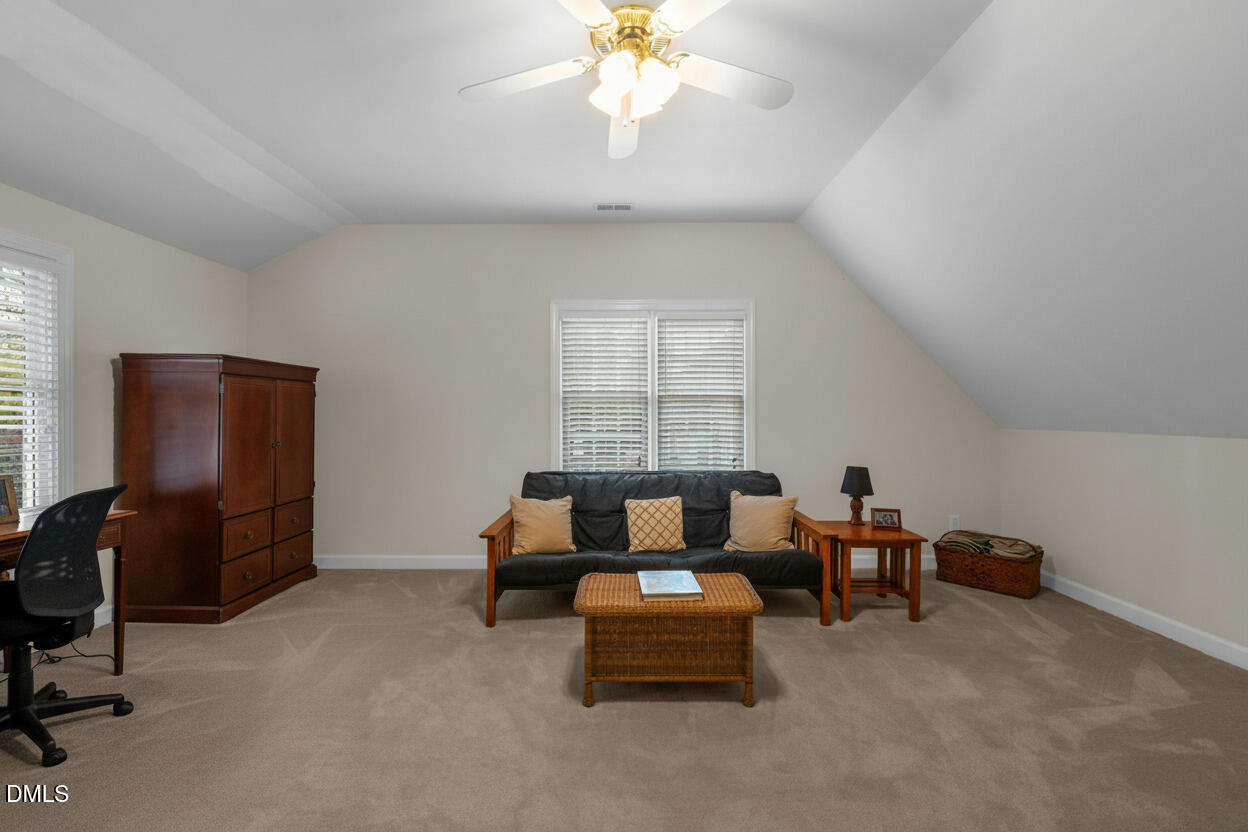 2605 Lizei Street Raleigh, NC 27616 - Photo 30 of 46 a living room with furniture and a window