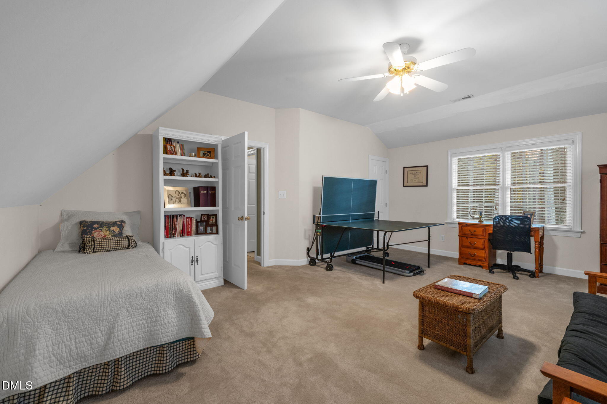 2605 Lizei Street Raleigh, NC 27616 - Photo 32 of 46 a bedroom with furniture and a chandelier