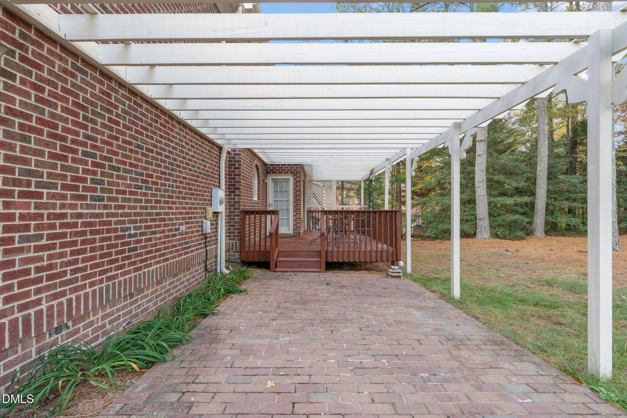 2605 Lizei Street Raleigh, NC 27616 - Photo 38 of 46 a backyard of a house with garden and outdoor seating