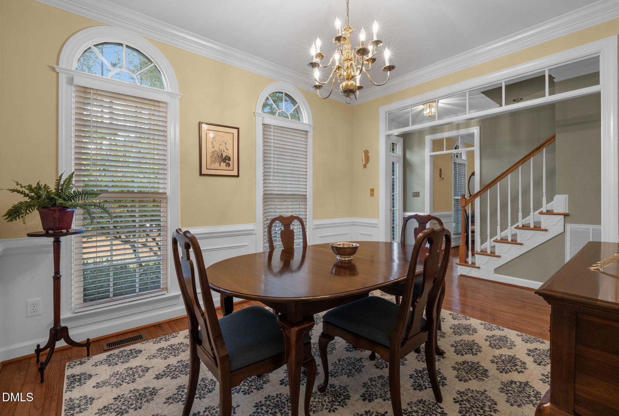 2605 Lizei Street Raleigh, NC 27616 - Photo 8 of 46 a view of a dining room with furniture and a chandelier
