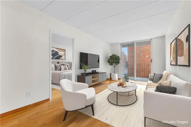 a living room with fireplace furniture and a flat screen tv