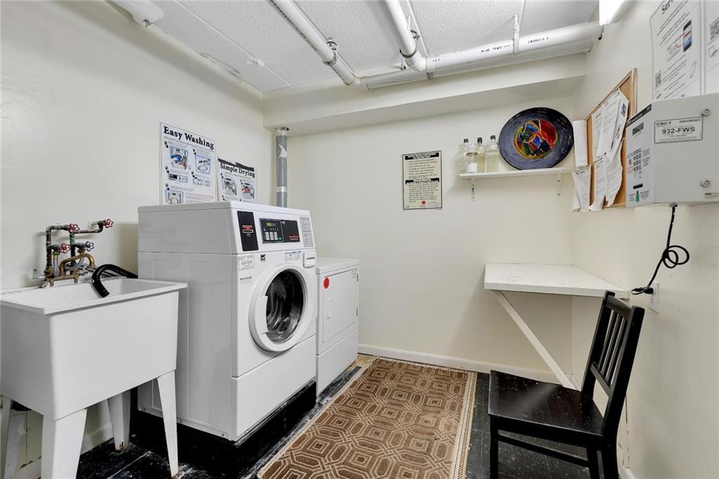 9995 Shore Road, Unit 18D Brooklyn, NY 11209 - Photo 7 of 10 a utility room with dryer and washer