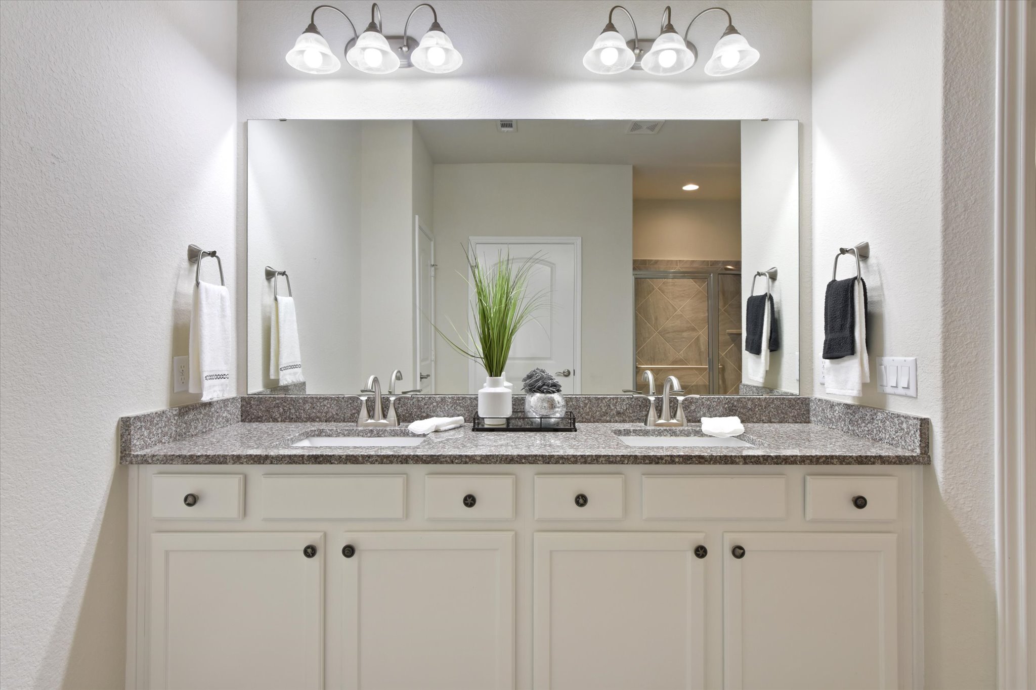 104 Coffee Mill Creek Road Georgetown, TX 78633 - Photo 24 of 40 Double vanity with granite counters provides ample space and elegant finishes in this well-appointed bathroom.