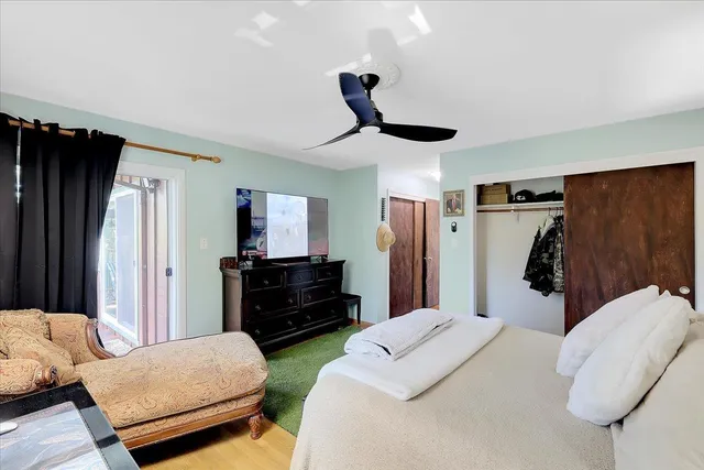 a bathroom with a granite countertop sink and a shower