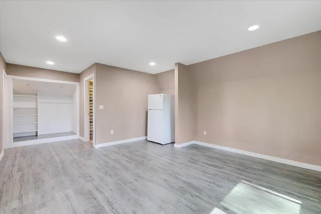 a kitchen with a sink stove and refrigerator