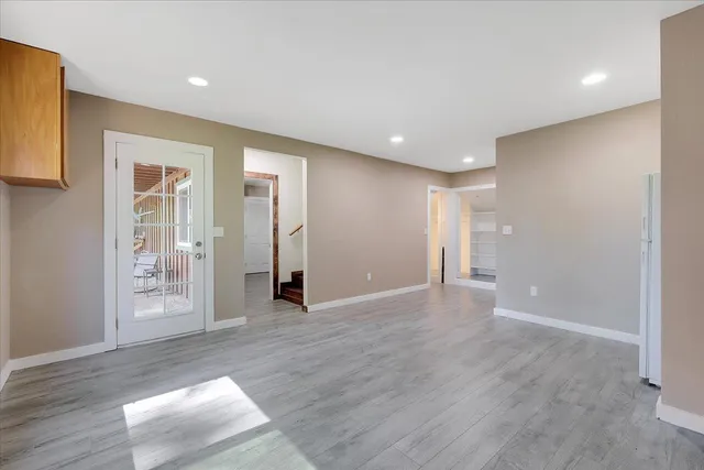 a view of balcony with wooden floor and outdoor seating