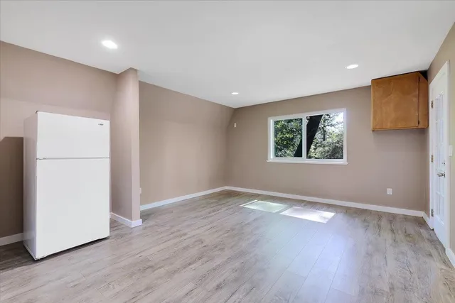 a view of a balcony with trees