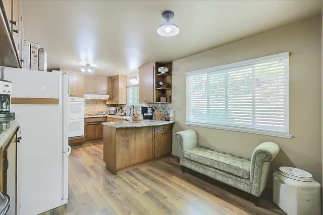 a view of a backyard with sitting area