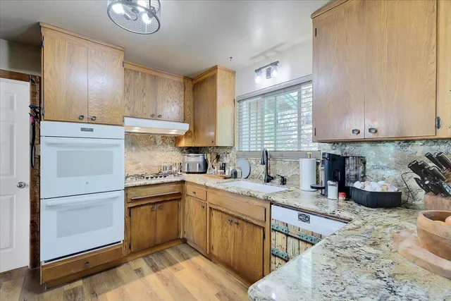 a view of a tree in the middle of a yard