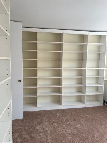 a bathroom with a granite countertop sink toilet mirror vanity and bathtub