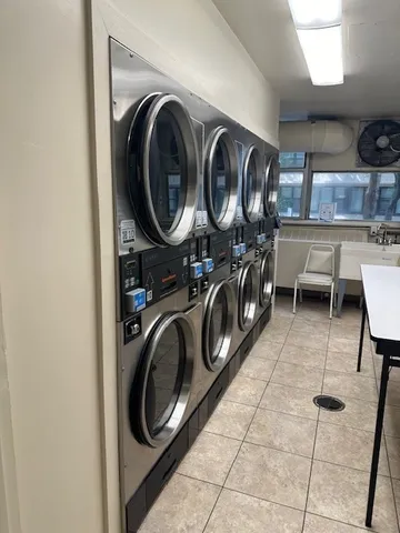 a room with a sink and cabinets