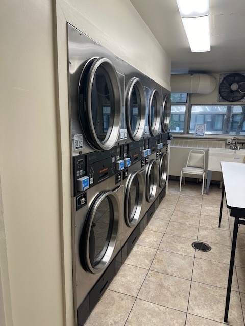 5757 North Sheridan Road, Unit 18J Chicago, IL 60660 - Photo 6 of 19 a utility room with sink dryer and washer