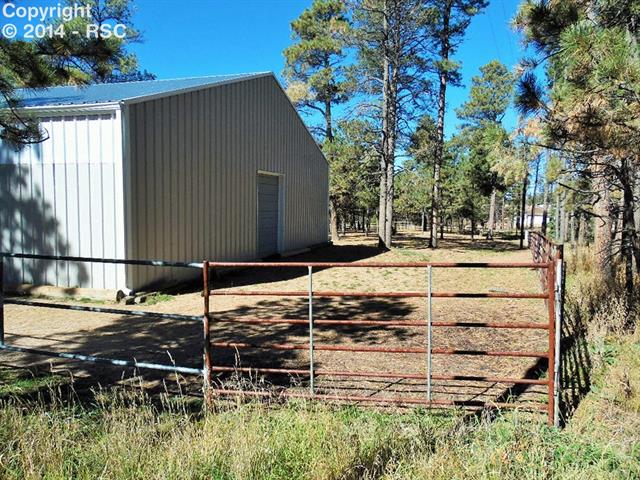 8535 Swan Road Colorado Springs, CO 80908 - Photo 14 of 25 Back Side of Arena and Turn Out Area (Panels Included)