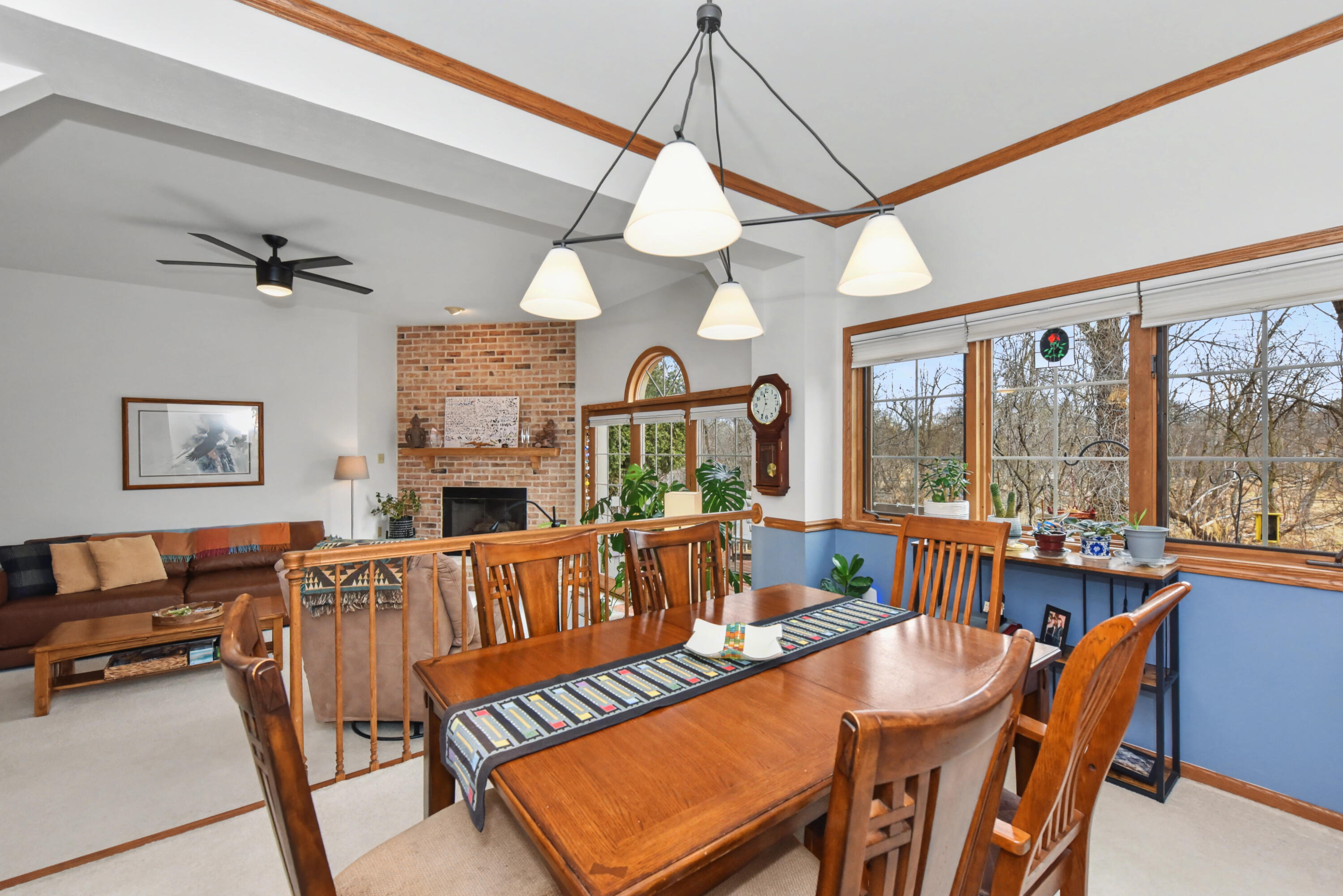 2870 Teal Ridge Court, Unit B Brookfield, WI 53045 - Photo 14 of 42 Dining area filled with natural light from surrounding windows, creating a bright and welcoming space for meals and gatherings.
