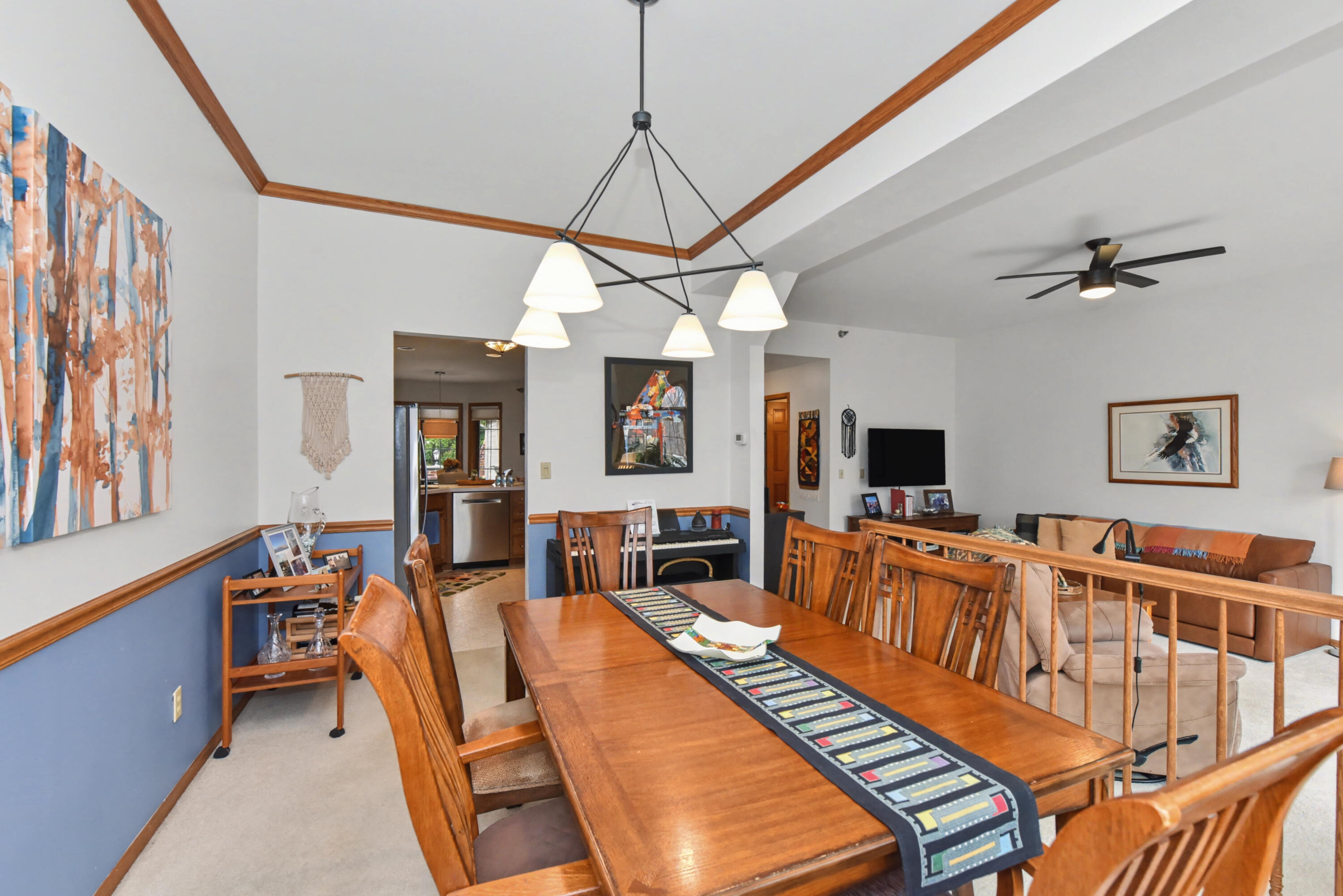 2870 Teal Ridge Court, Unit B Brookfield, WI 53045 - Photo 15 of 42 Dining area with open sightline into the kitchen, creating an easy flow between spaces.