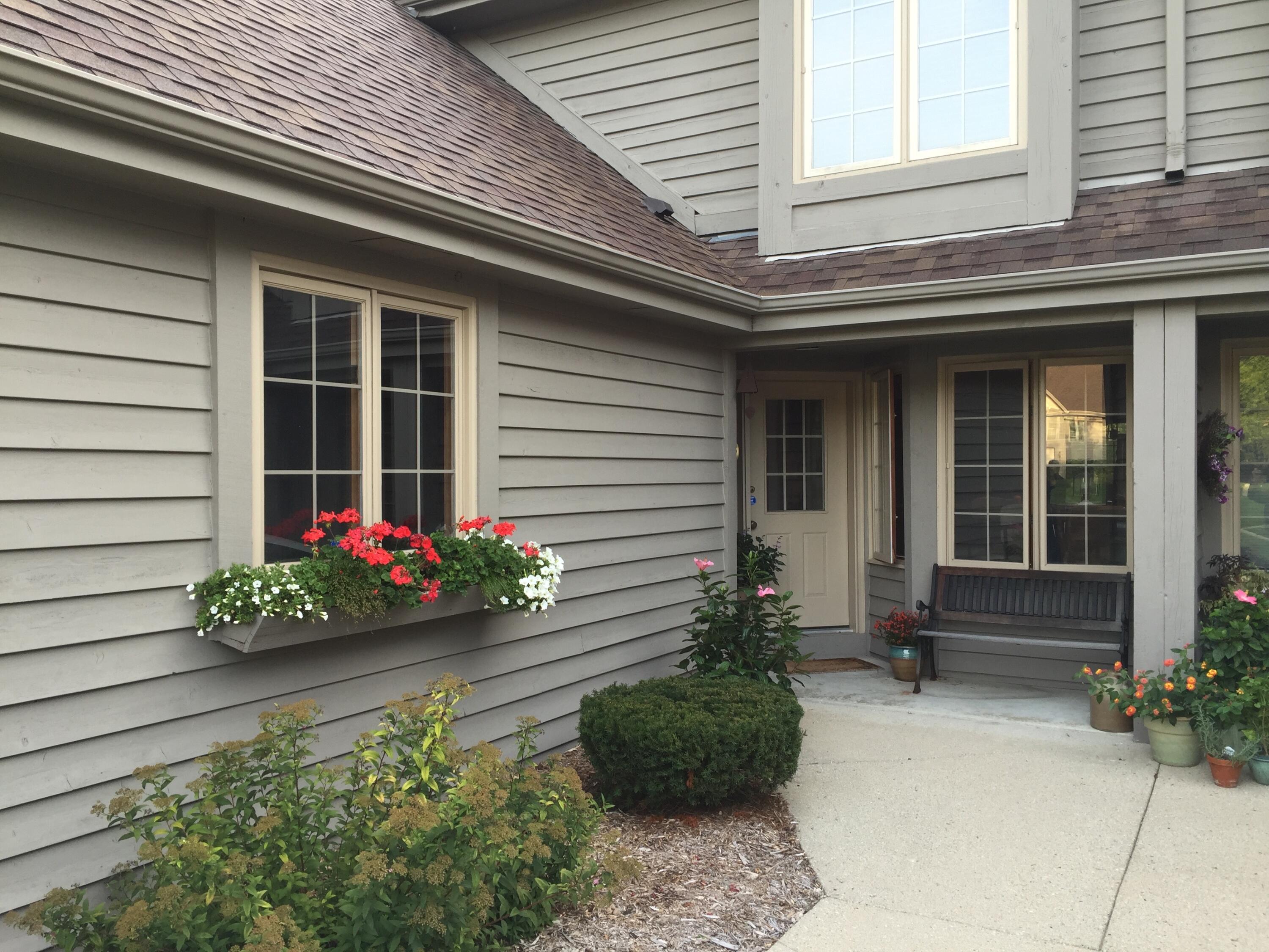 2870 Teal Ridge Court, Unit B Brookfield, WI 53045 - Photo 37 of 42 Welcoming front entrance with colorful landscaping.