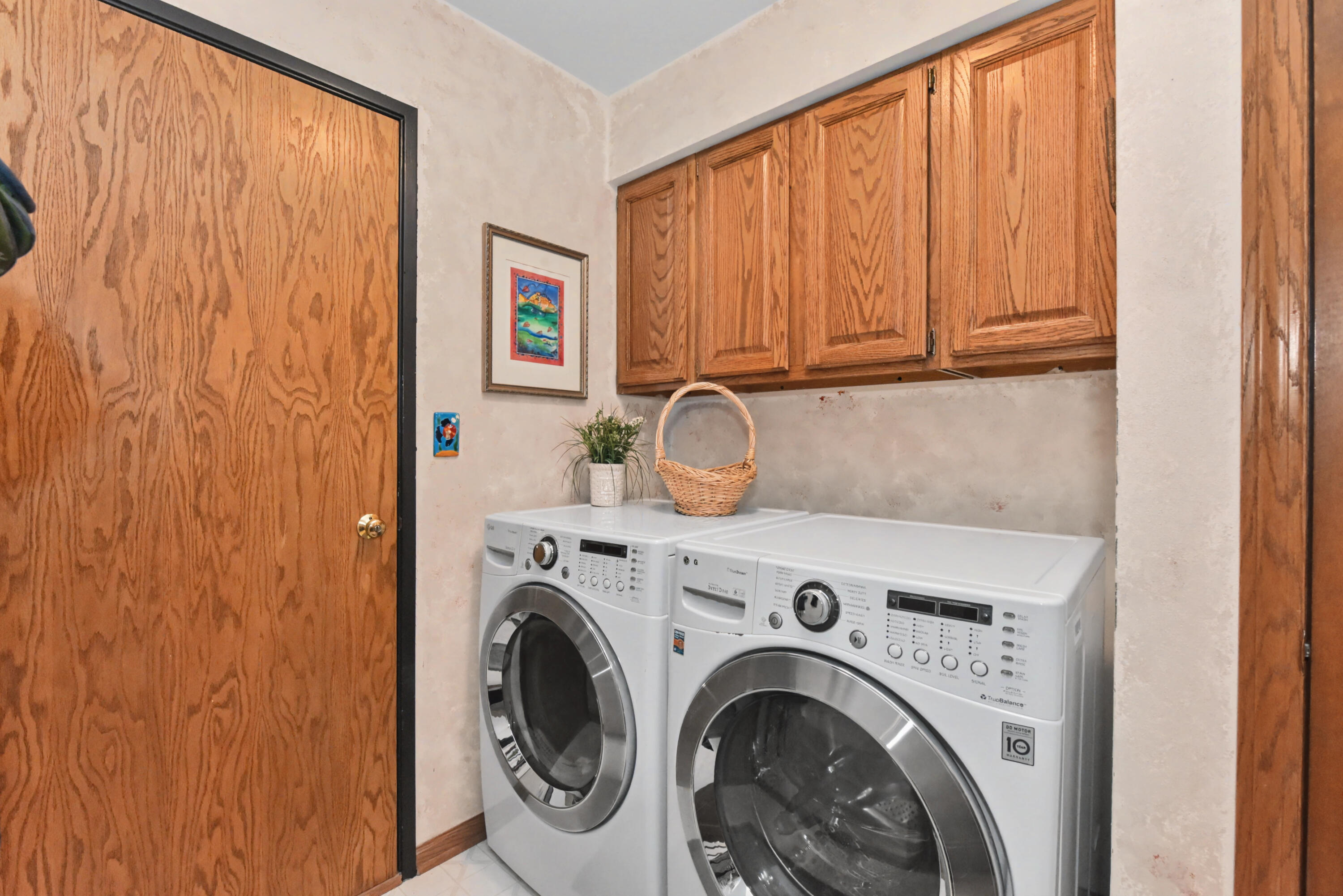 2870 Teal Ridge Court, Unit B Brookfield, WI 53045 - Photo 5 of 42 First-floor laundry and mudroom with direct access to the attached 2-car garage.