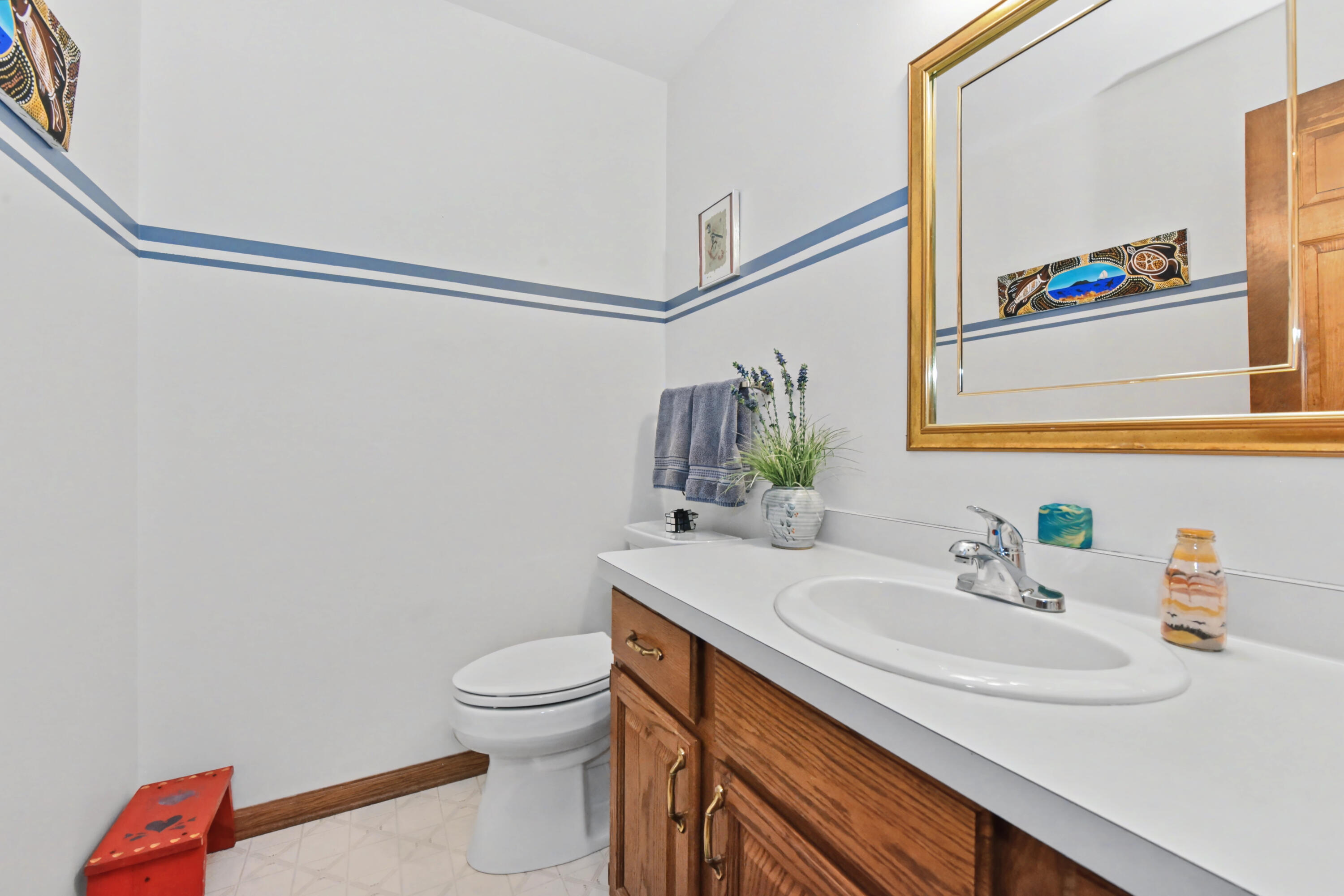 2870 Teal Ridge Court, Unit B Brookfield, WI 53045 - Photo 6 of 42 Main floor half bath conveniently located near the entry and main living areas.