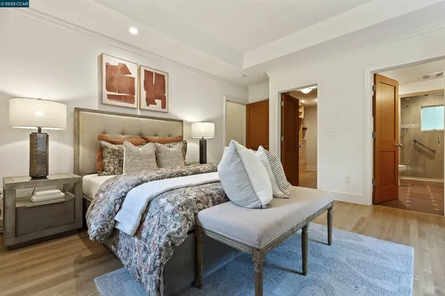 a bedroom with two beds and a large window