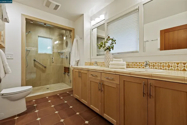 a bedroom with a large bed and a couch