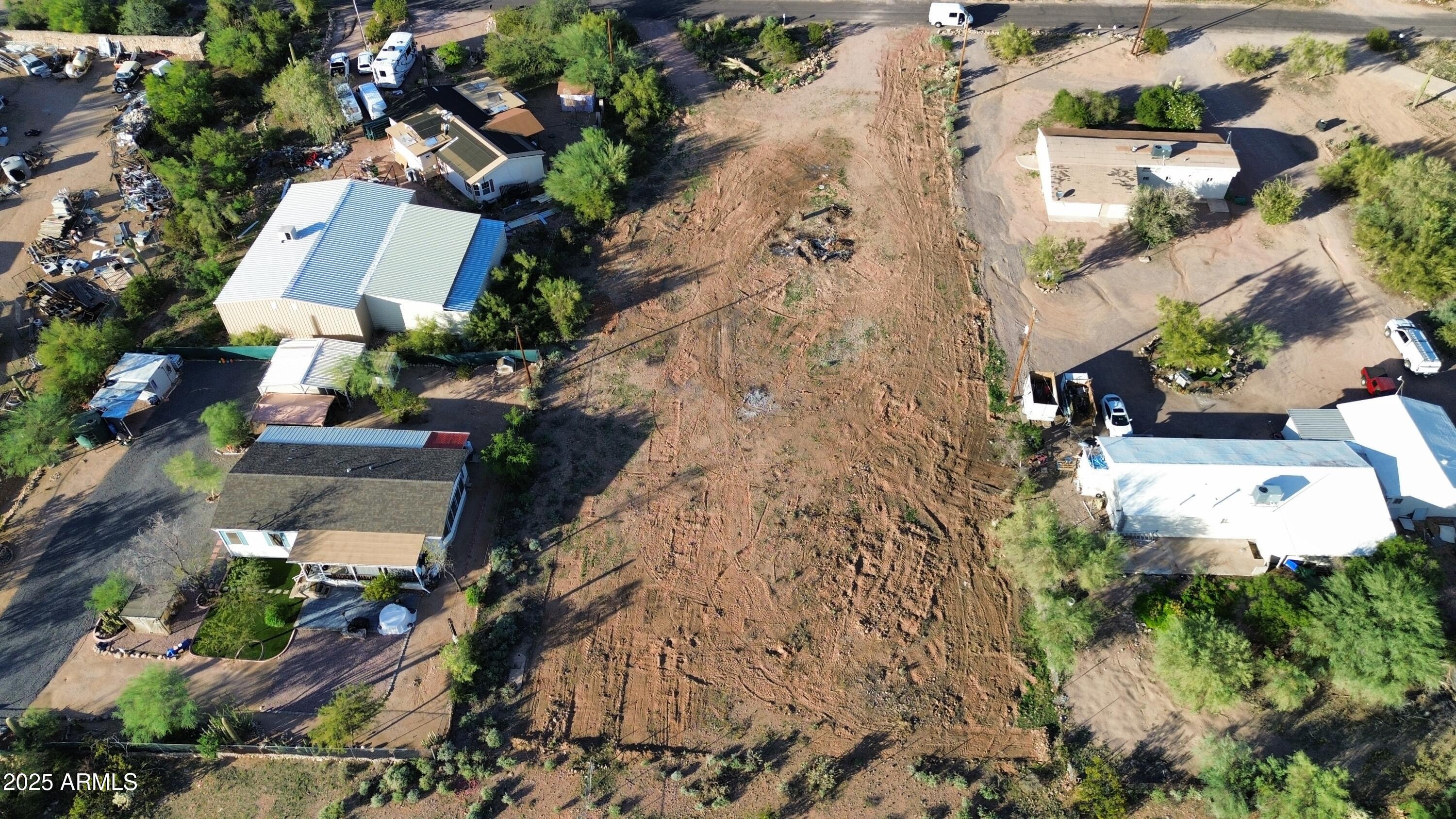 an aerial view of a house with a yard and garden