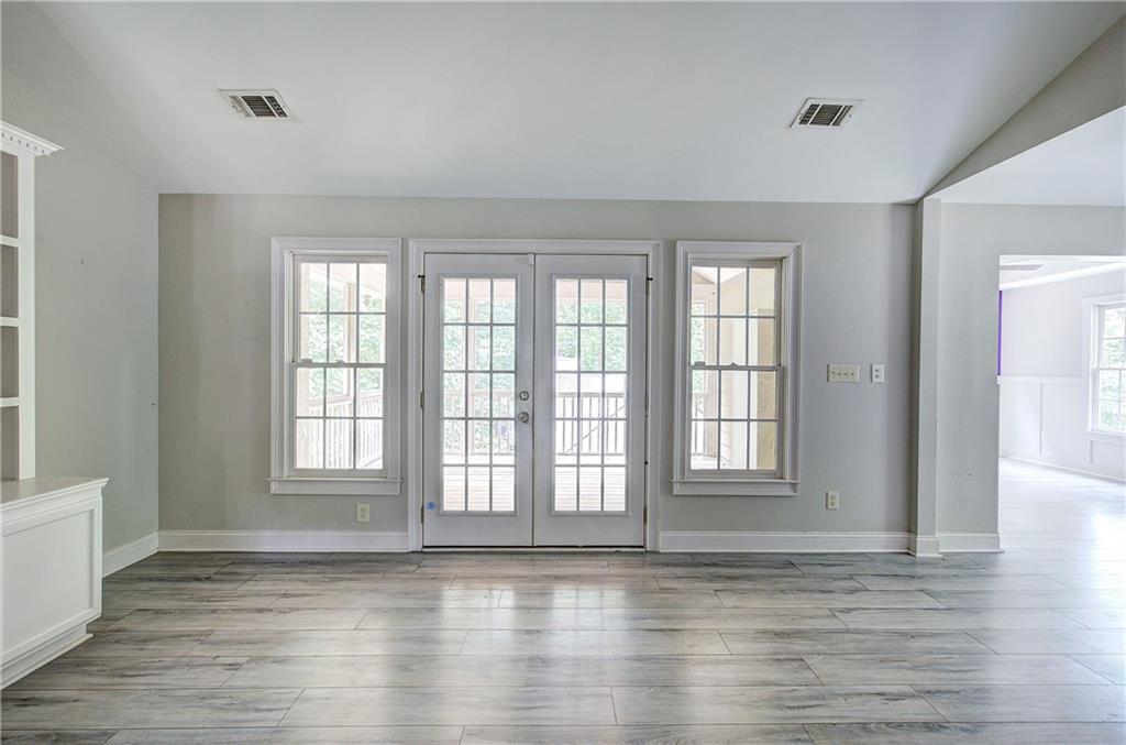 561 Holland Road Dallas, GA 30157 - Photo 16 of 48 a view of an empty room with wooden floor and a window