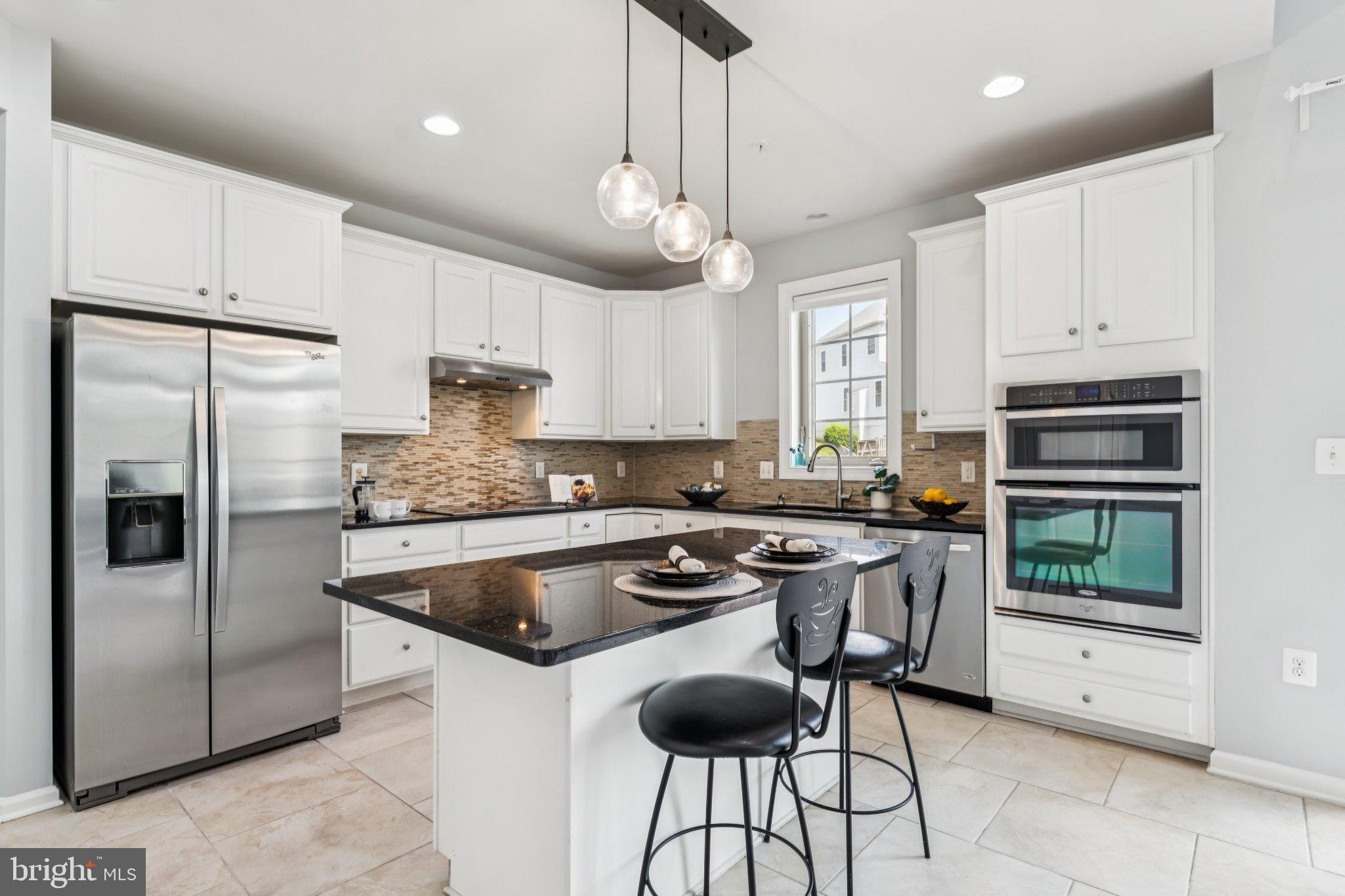 1105 Verbena Court Silver Spring, MD 20906 - Photo 6 of 78 Sleek modern kitchen with elegant finishes.